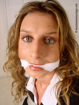 Free porn pics of Business babe bound and gagged on her coffee table 25 of 39 pics
