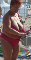 Free porn pics of Red-haired granny at the beach 5 of 185 pics